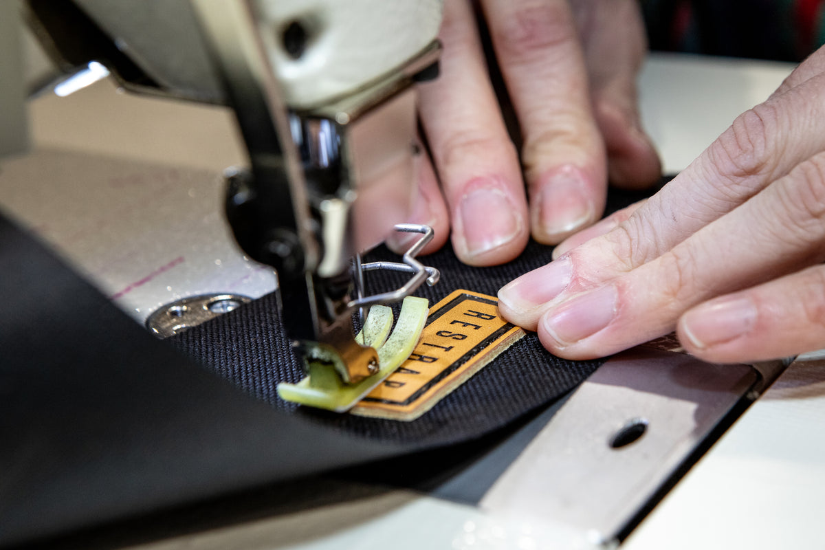 restrap label being stitched onto a product