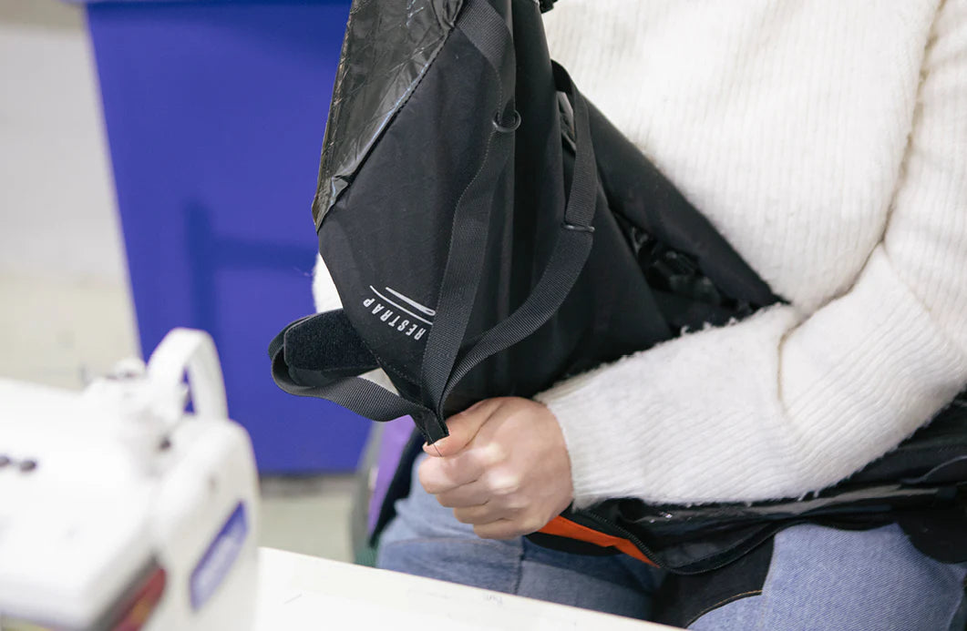 a frame bag being handled by a machinist at restrap's factory in the UK