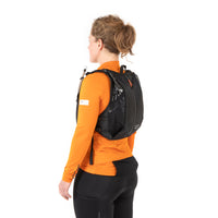 woman wearing the restrap race hydration vest, shown from a rear quarter view