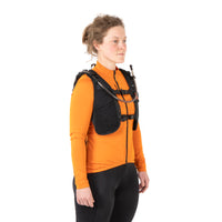 female rider wearing restrap race hydration vest, pictured from the front quarter on a white background