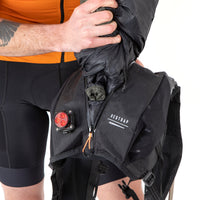 closeup of a jacket being packed into the restrap race hydration vest main compartment