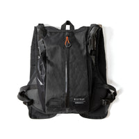 Rear of the Restrap race hydration vest on a white background, showing the reflective label and zip compartment