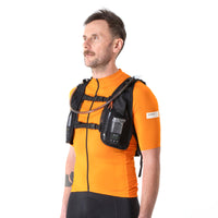 Front of the Restrap race hydration vest being worn by a man, showing the front storage