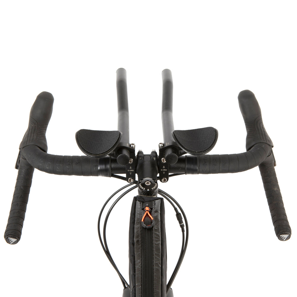 restrap race top tube bag mounted to a titanium bike, shown from a behind the handlebars perspective