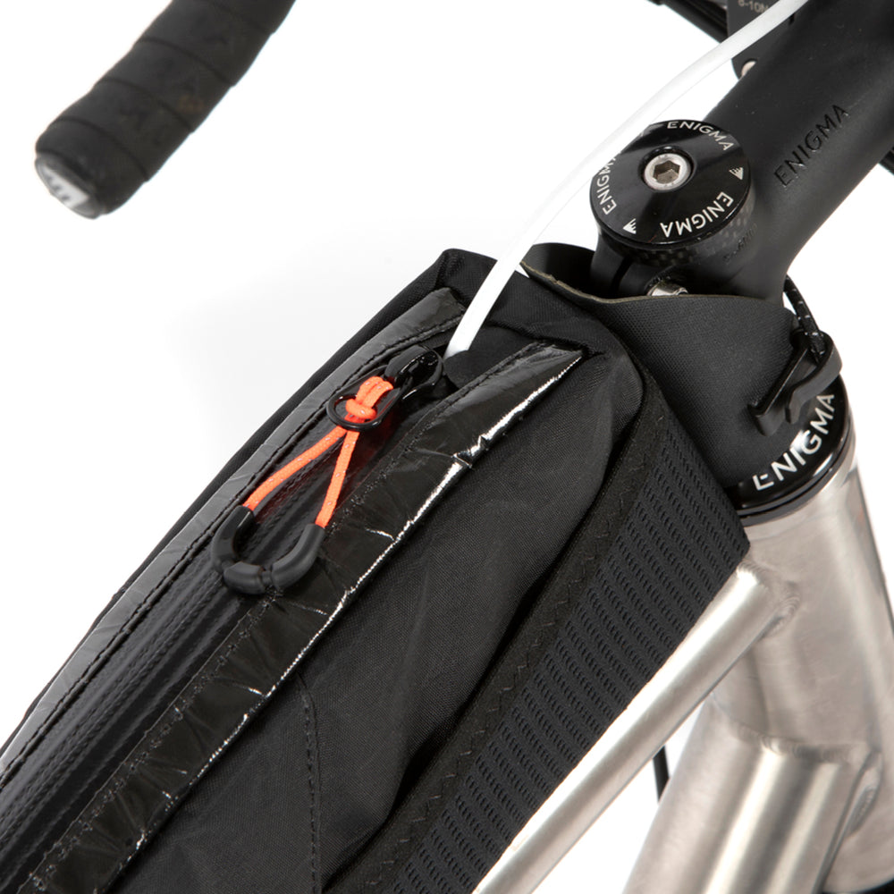 closeup of restrap race top tube bag mounted to a titanium bike
