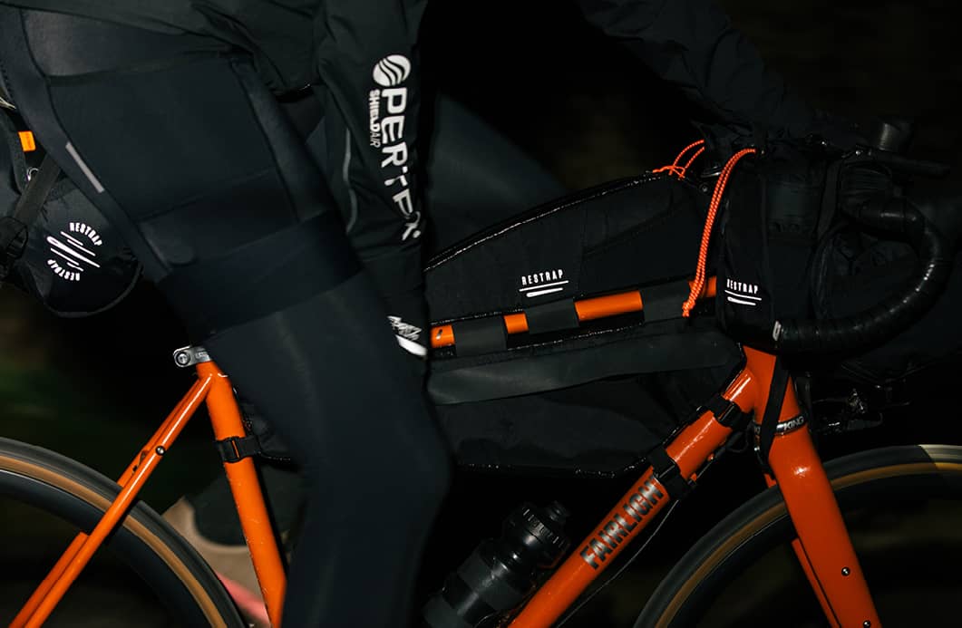 Restrap Race Range photographed at night to demonstrate the reflective elements on the bags