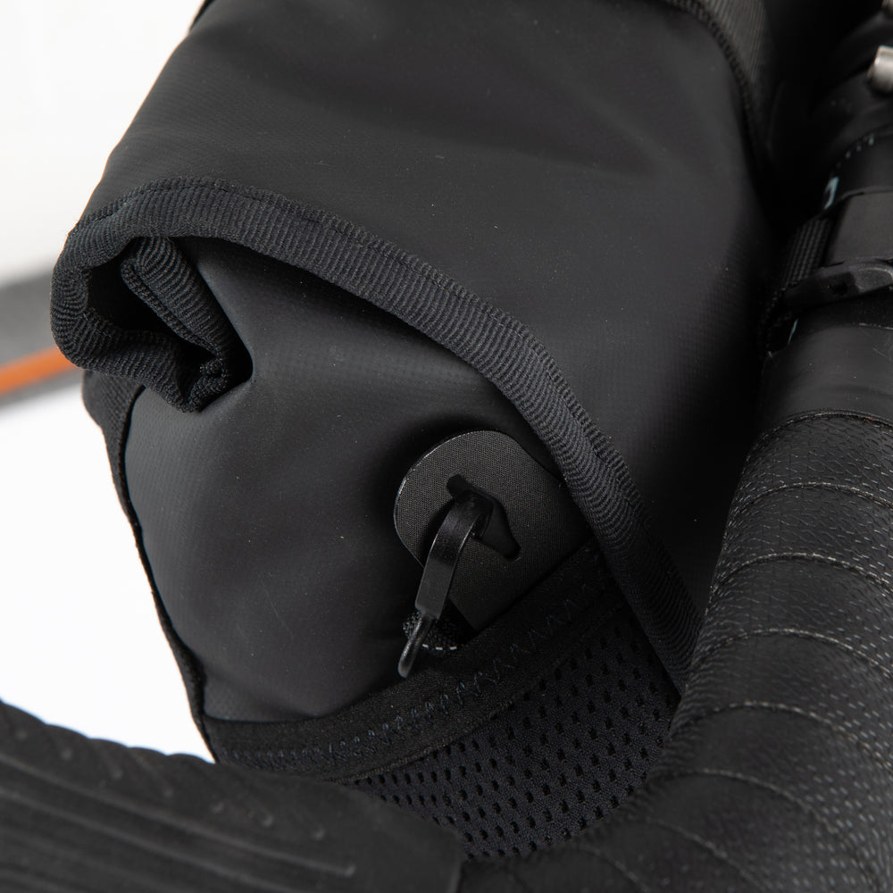 Close up of the side pockets on the Restrap Rolltop Canister Bag