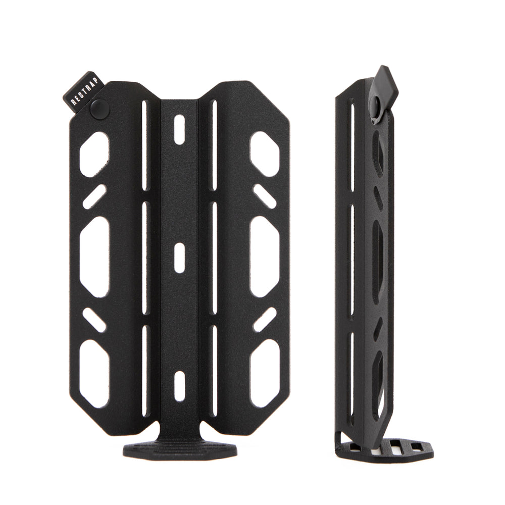 A black laser cut aluminium cargo cage with Restrap branded rubber label visible.
