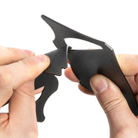 A black portable coffee dripper being clipped together