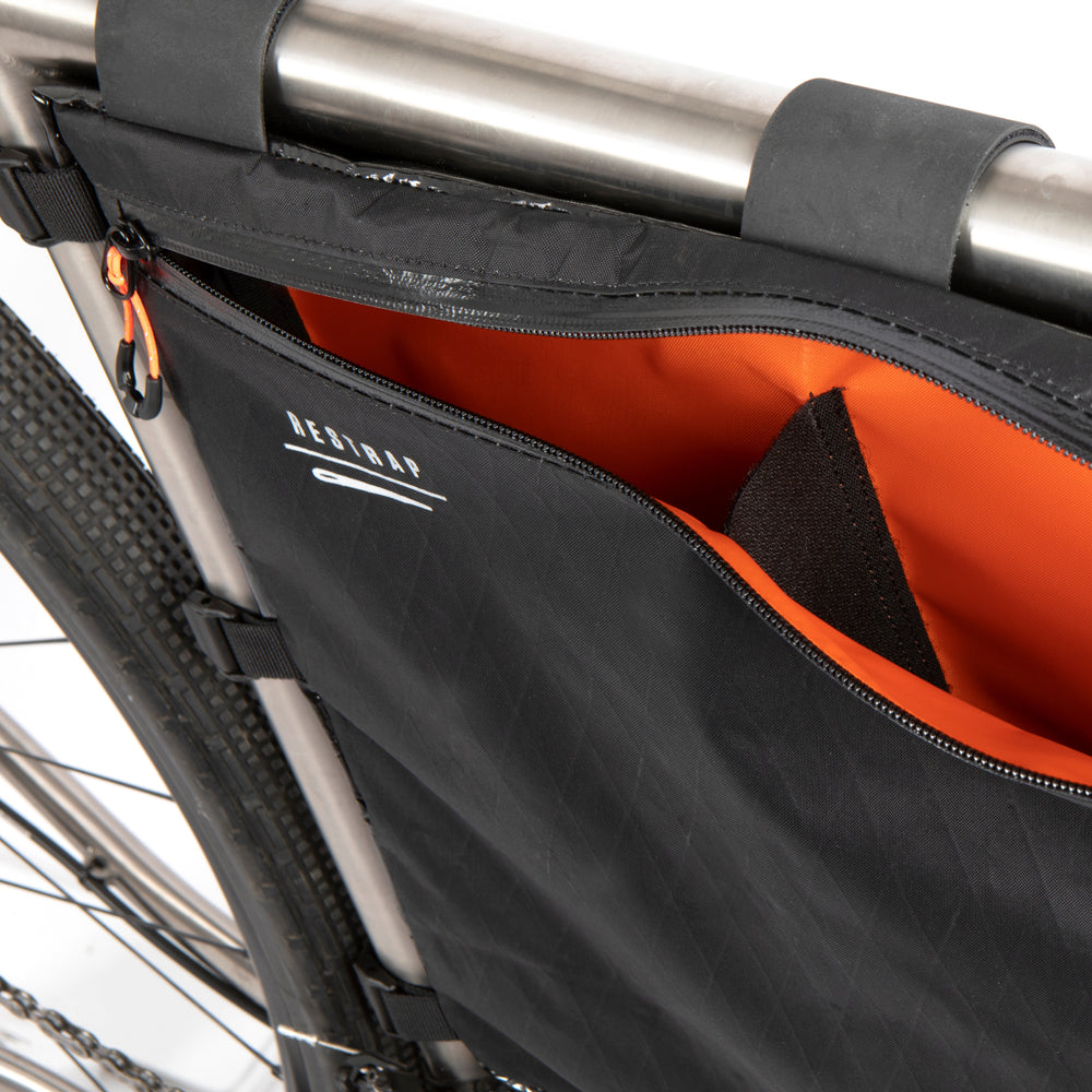 closeup image of the internal storage on the restrap custom frame bag in x21 or race range fabric