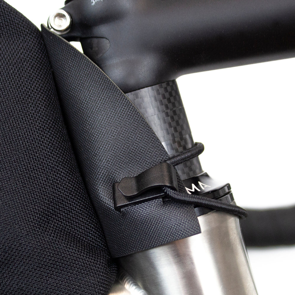 closeup of how restrap top tube bag fits onto the headtube of a bicycle