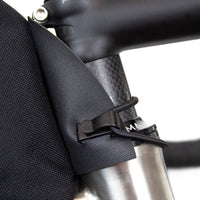 closeup of how restrap top tube bag fits onto the headtube of a bicycle
