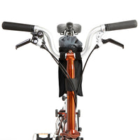 A black City Stem Bag with a capacity of 1 litre, attached to the handlebars of a folding bicycle.