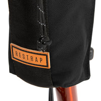 A closeup of the restrap City Stem Bag with a capacity of 1 litre, attached to the handlebars of a folding bicycle.