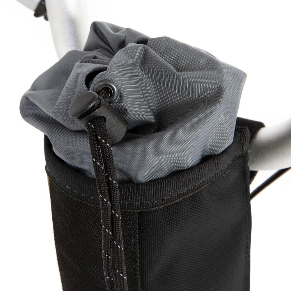 A closeup of the restrap City Stem Bag with a capacity of 1 litre, attached to the handlebars of a folding bicycle.