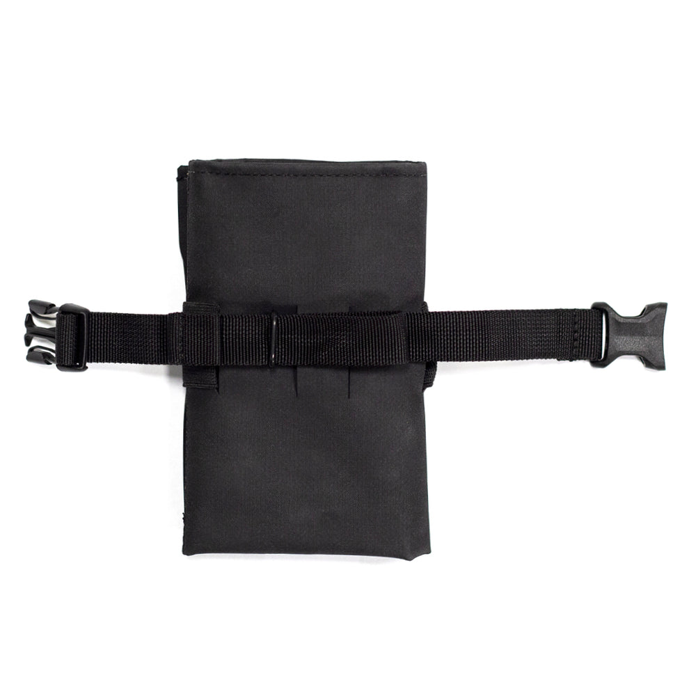 A black Restrap tool roll with a visible brand label, designed to be attached to a bicycle saddle or kept in a jersey pocket.