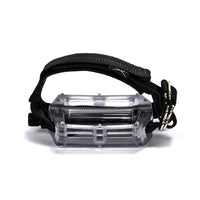 A black Restrap horizontal pedal strap fitted onto a cycling pedal, with visible nylon webbing and metal buckle.