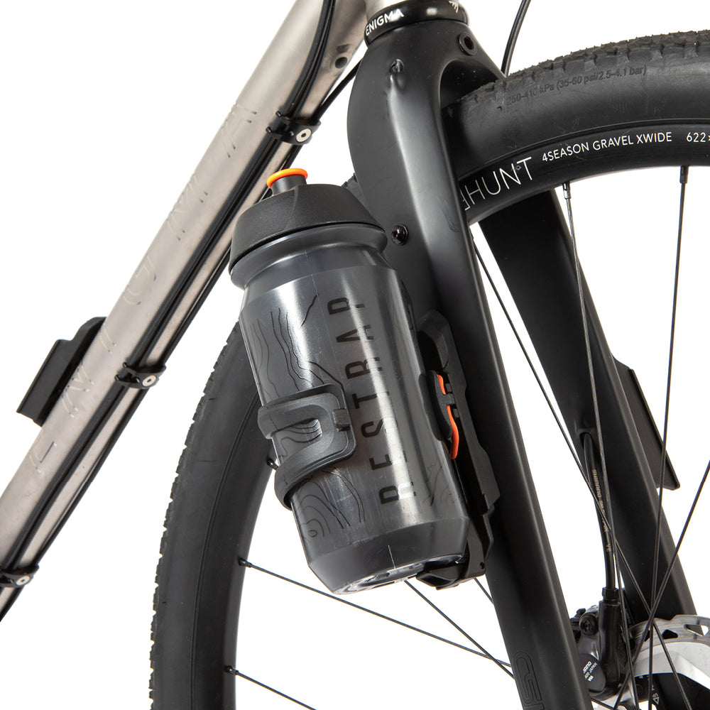 Restrap switch multi mount and bottle cage on a fork with white background