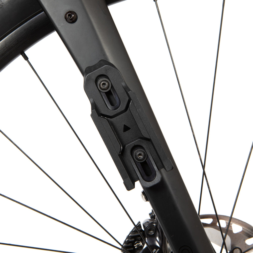 Close-up of a bicycle's fork with switch multi mount attached on a white background