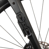 Close-up of a bicycle's fork with switch multi mount attached on a white background